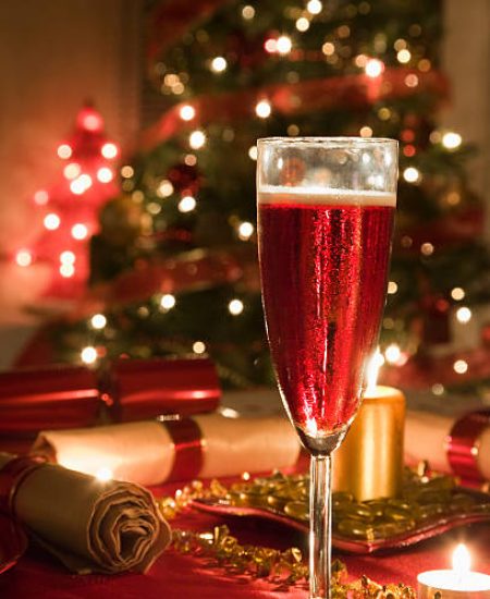 Glass of Rose Champagne on a decorated Christmas day dinner table